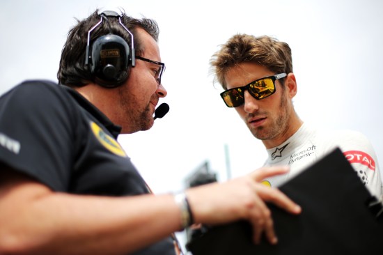 (L to R): Julien Simon-Chautemps (FRA) Lotus F1 Team Race Engineer with Romain Grosjean (FRA) Lotus F1 Team on the grid. British Grand Prix, Sunday 5th July 2015. Silverstone, England.